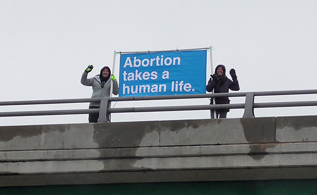 pro-life banner driver bridge