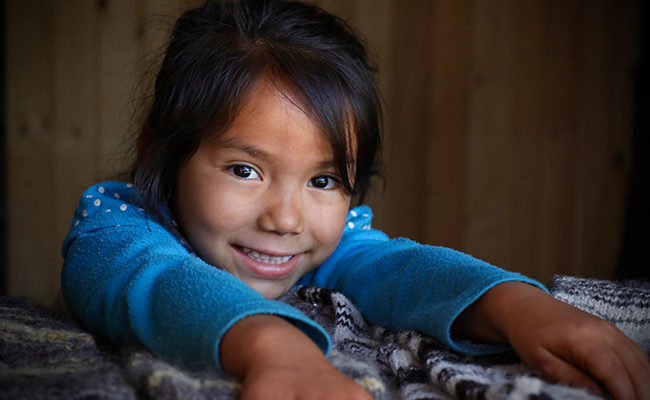 smiling girl immigrant immigration border help families