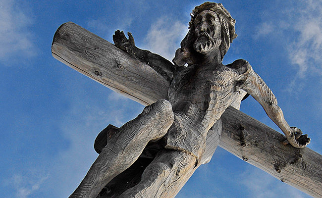 suffering carved wooden Jesus on cross