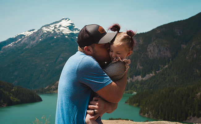 dad father child hug kiss babysit