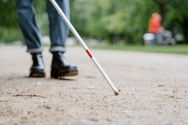 Blind person walking - ministry to the disabled