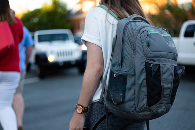 student with backpack starting a new school year
