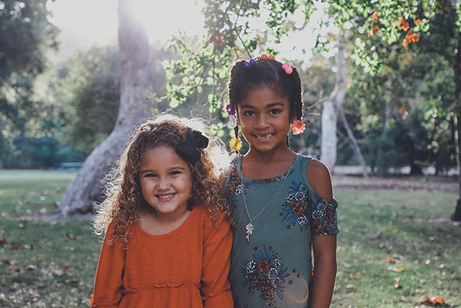 two girls smiling - children missions