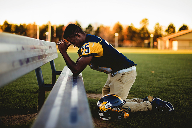 football praying prayer kneeling sports