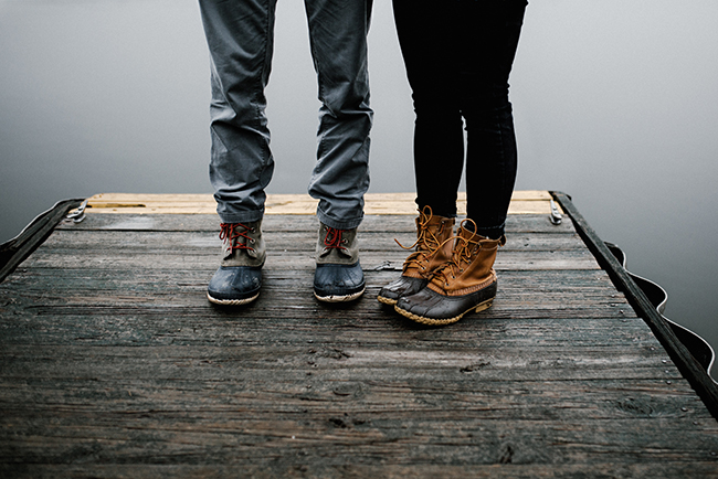 Man and woman in rain boots standing on dock - church planting spouse