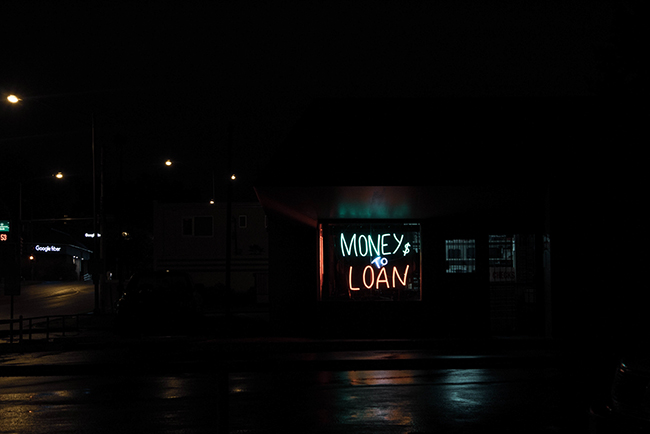 Neon sign lit up at night - payday loans