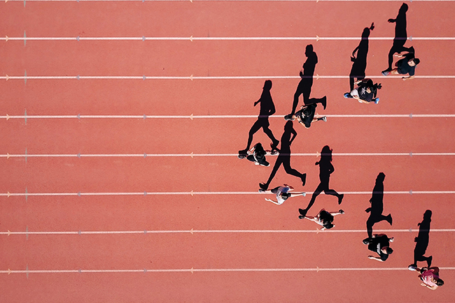 group of people running on track - preparing for retirement
