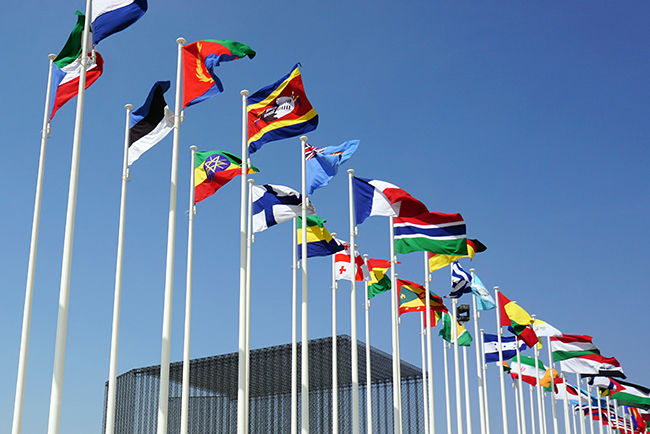 Rows of international flags flying in the air - 2024 global Christianity trends
