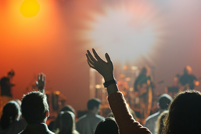 People raising their hands in worship - What does the Bible say about worship