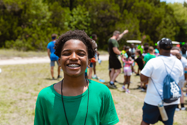 kid smiling at summer church camp