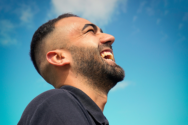 Profile of man laughing - most pastors are healthy