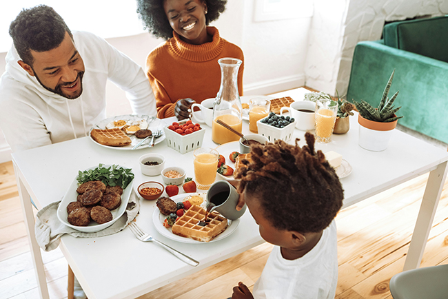 Family sitting around breakfast table - Sabbath for pastors